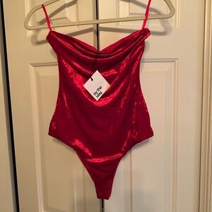 by the way. Vibrant Red body suit